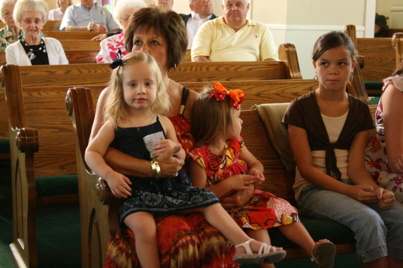 a group of people sitting next to each other