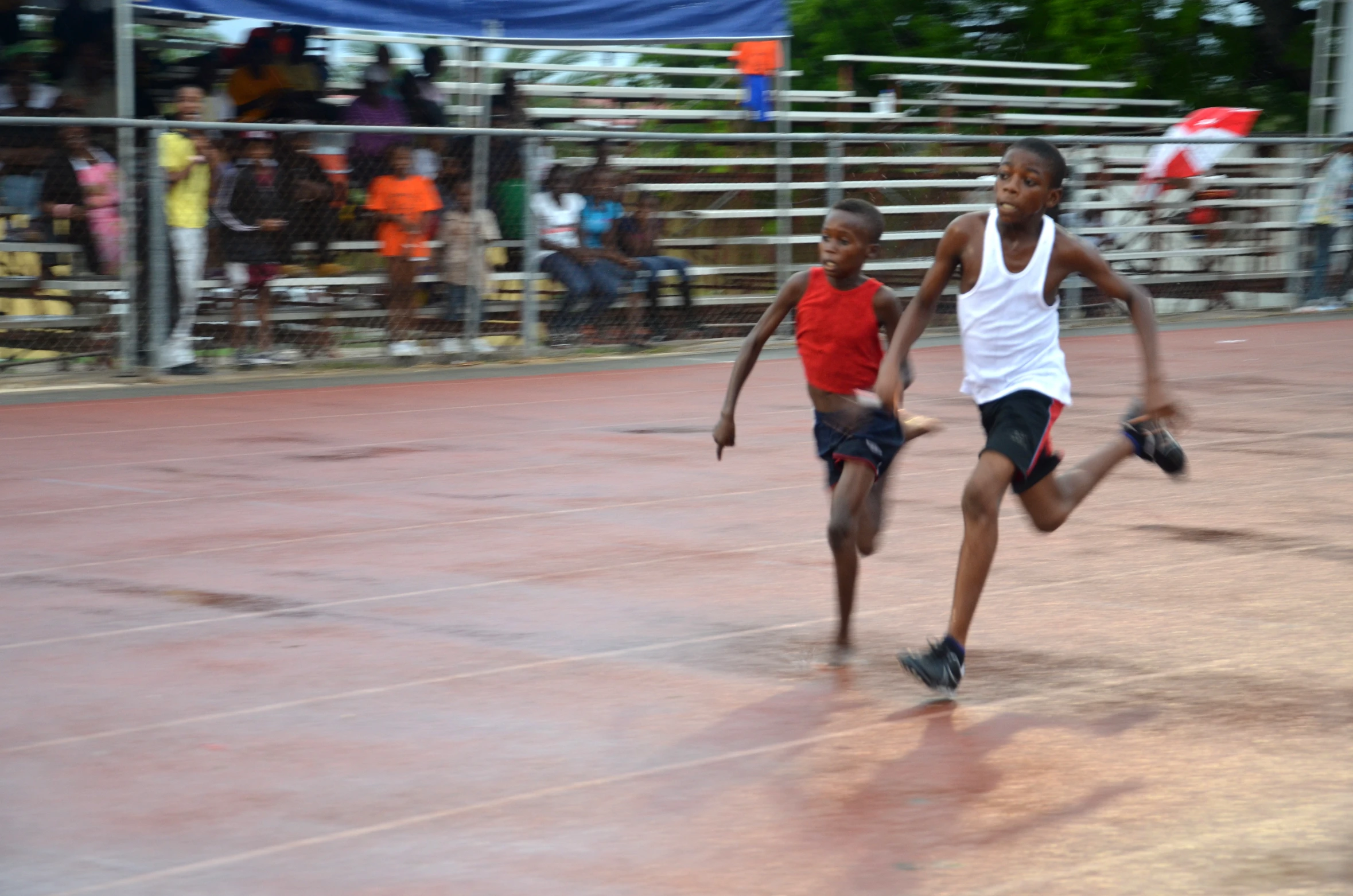 two young men running towards each other during a game