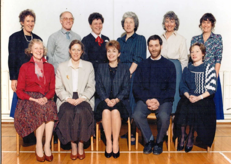 an old po of a group of people posing for a picture