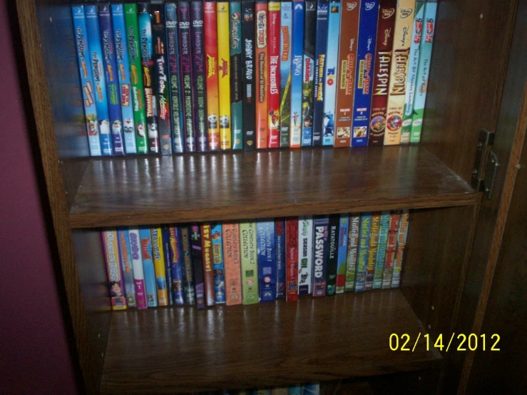 a wooden shelf holding many books inside of it