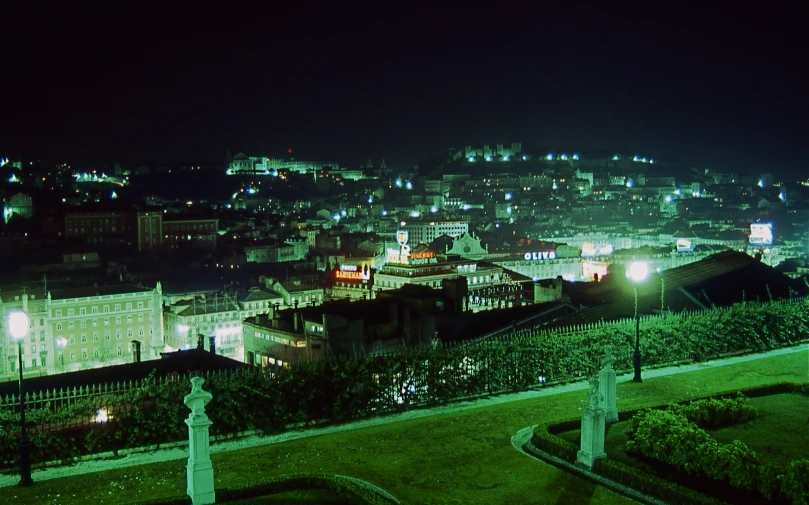 a town is seen at night and lit up