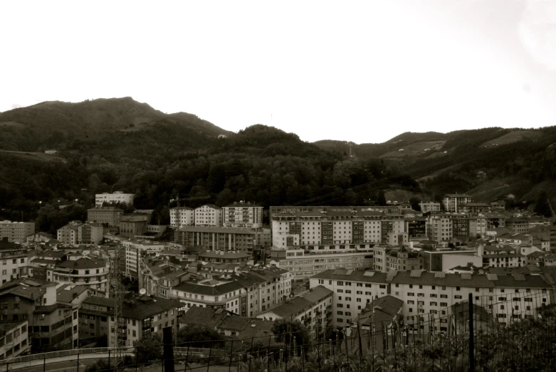 the city sits near many hills and tall trees