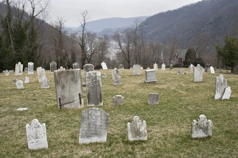cemetery with headstones and graves in foreground
