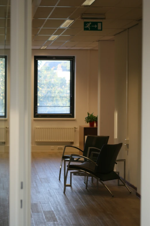 a room that has wooden floors and furniture