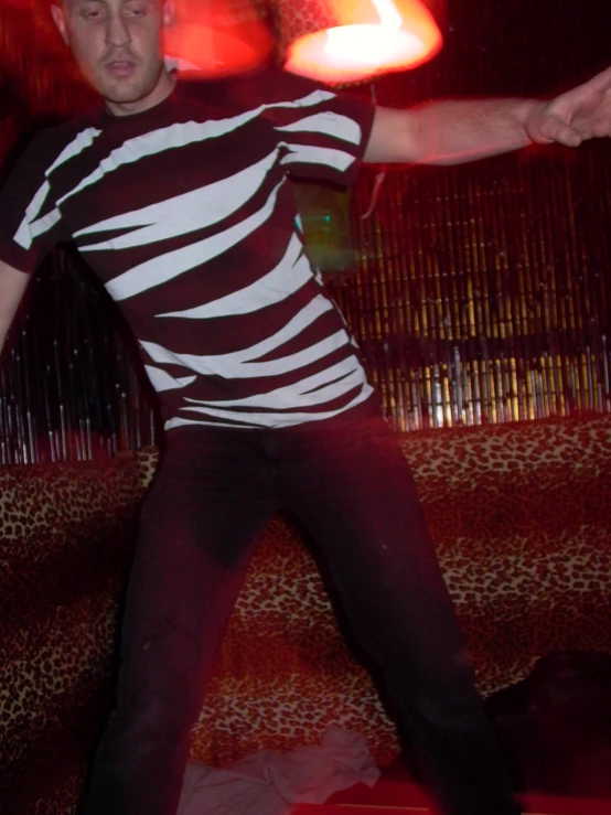 a man on a skateboard in front of bright lights