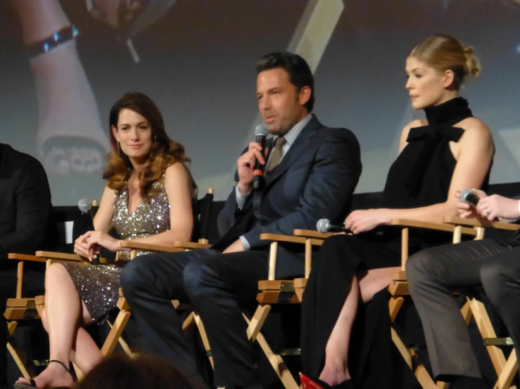 four actors are seated side by side while talking