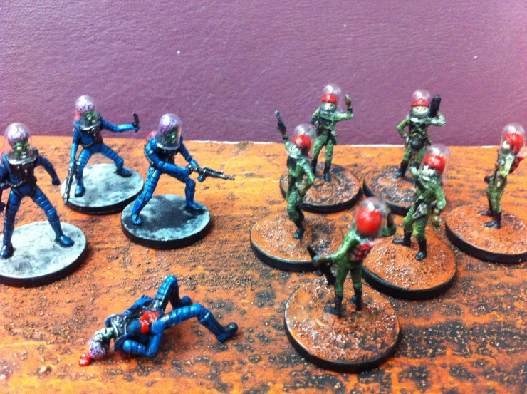 toy soldiers and their weapons, and painted bases