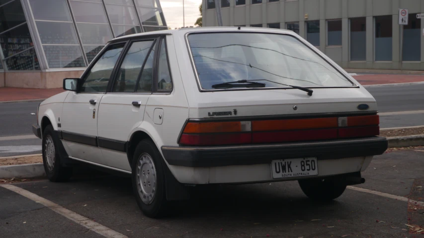 a white car parked in a parking lot