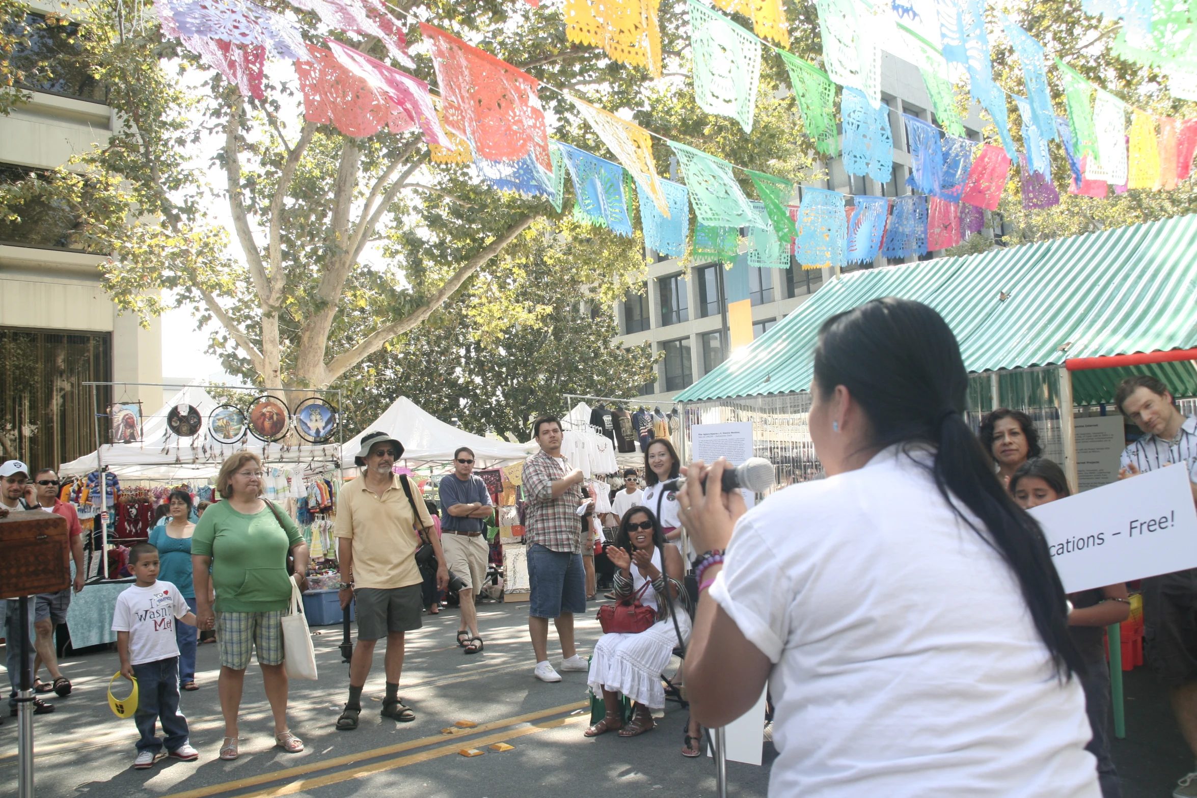 a girl is taking pictures of a crowd