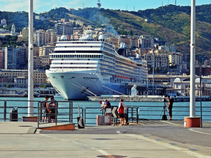 people boarding a cruise ship on the dock