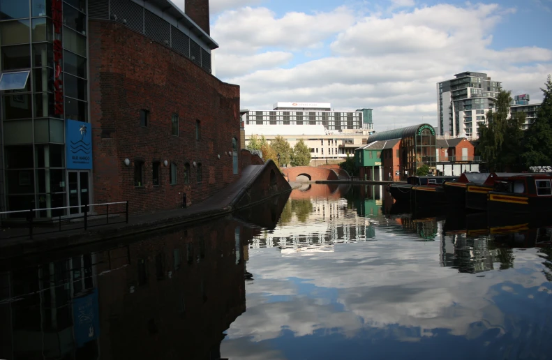 view of a canal next to a brick building