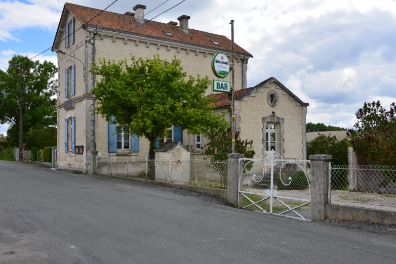 a large building with a gate in front of it