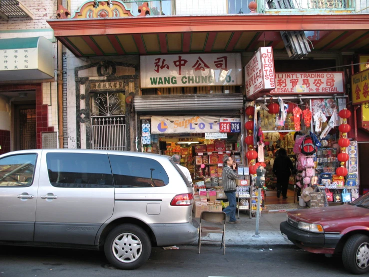 an automobile parked next to a shop in china