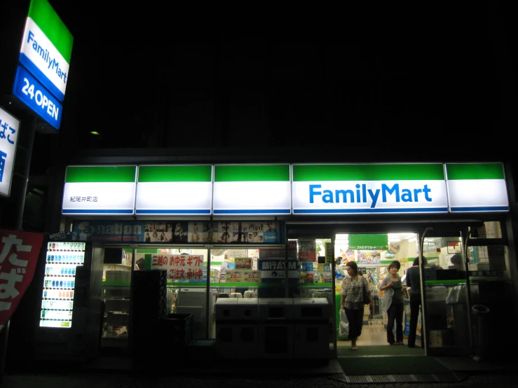 a family mart store lit up at night