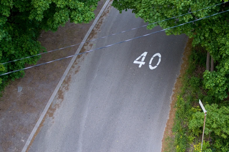 a road that is in the middle of some trees