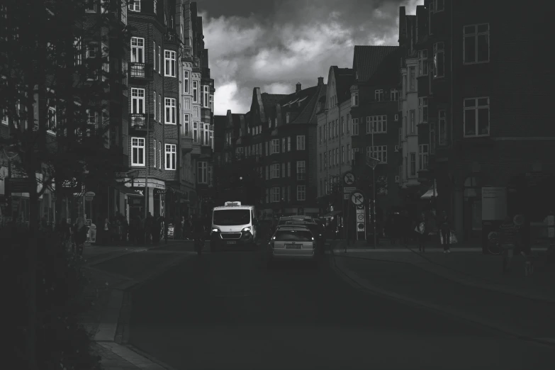 a car driving in a dark city street