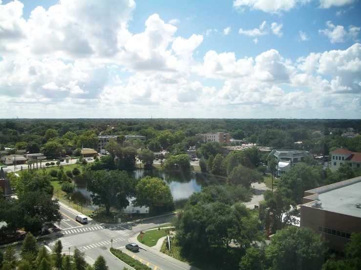 the view out of a tall window of a city