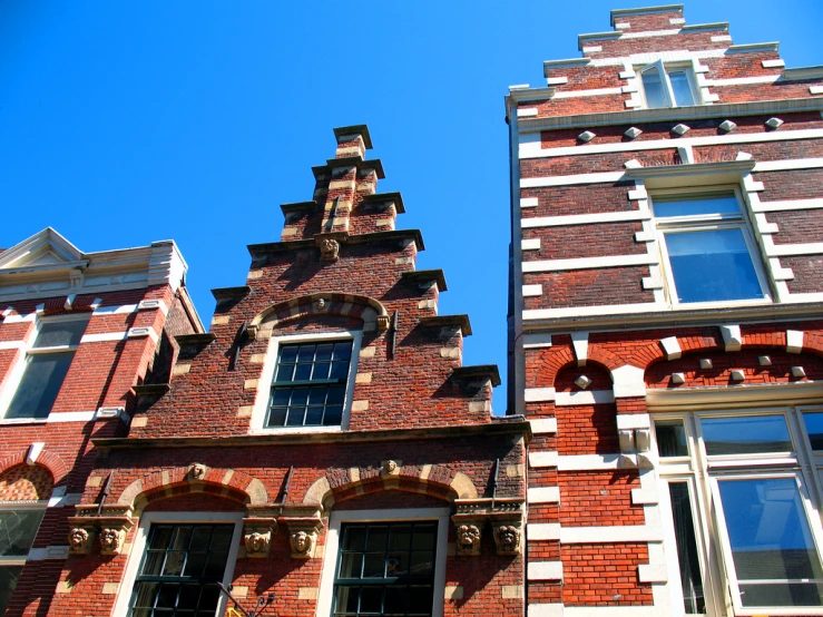 a clock that is at the top of a brick building