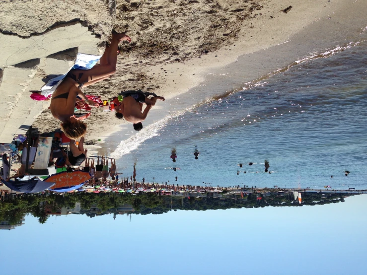 people in a park at the water and beach