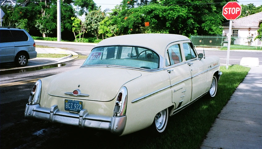 old vintage car parked on the street in the city