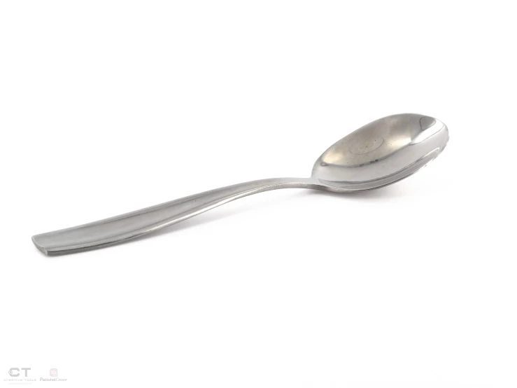 an antique spoon is shown on a white background
