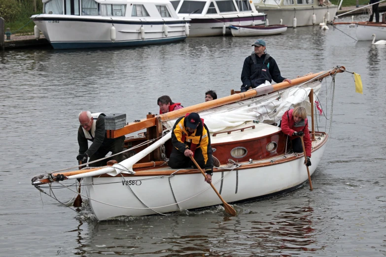 people in a boat moving on a body of water