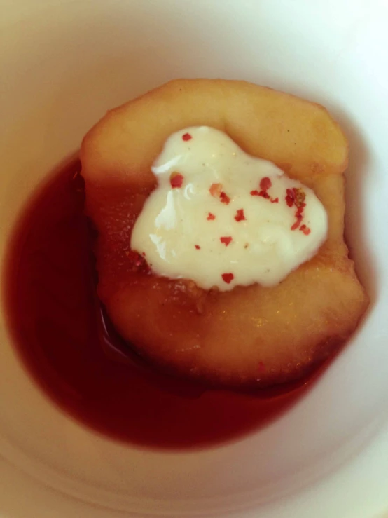 small plate of pastry with cream in a sauce