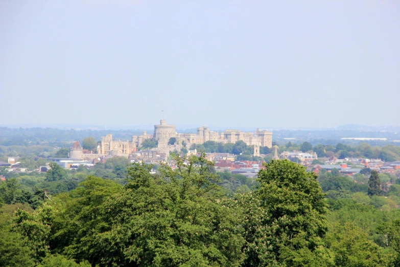 there are many trees in front of this view of the town