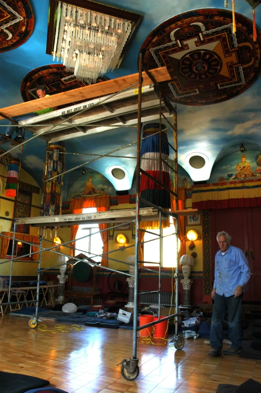 an artist looking at his work in a theater