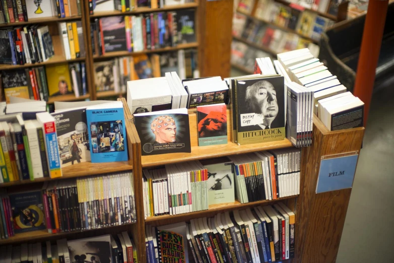 a book shelf in a bookstore filled with books