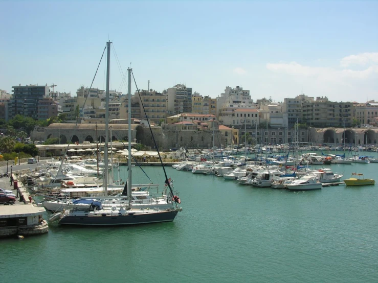 a group of boats in the water and some buildings