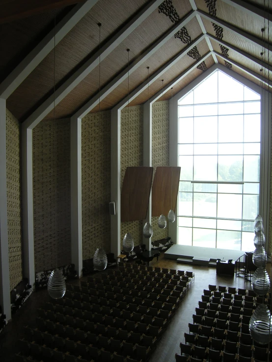 the inside of a church is filled with pews