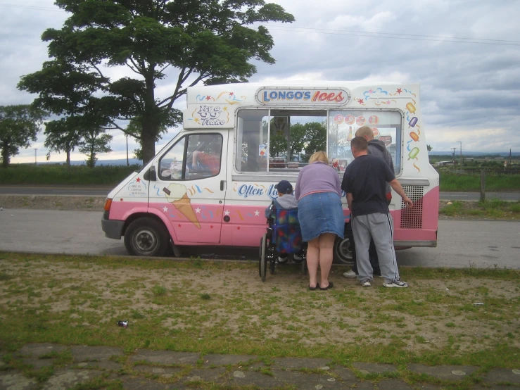 the two people are leaning against the ice cream truck
