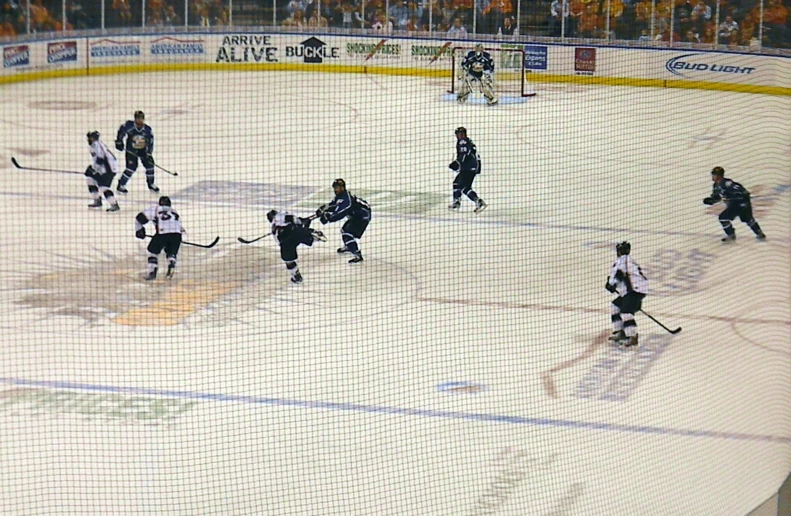 a hockey game going on in an arena