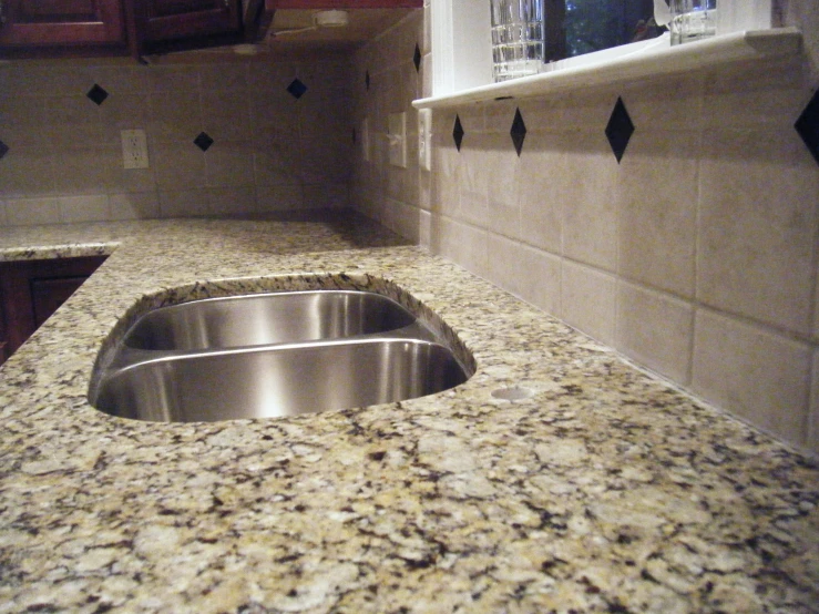 a white counter top with a sink and oven