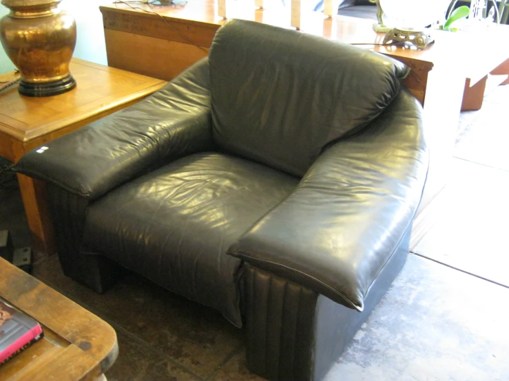 leather recliner chair sitting in front of table