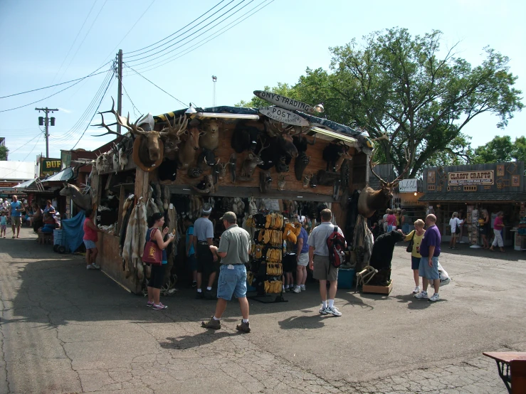 people at an outdoor market with the open air market in front of them