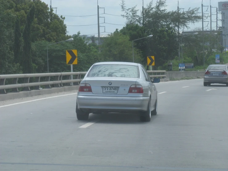 cars are riding down the highway side with the back lights on