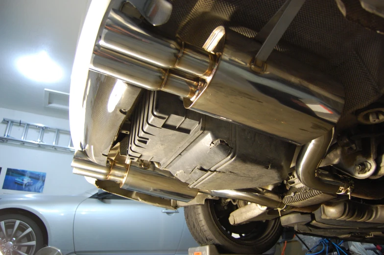 the exhaust of an automobile is shown with exhaust pipe and disc