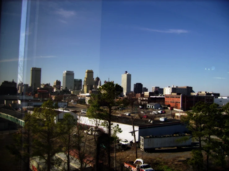 an image of a city as seen from a train