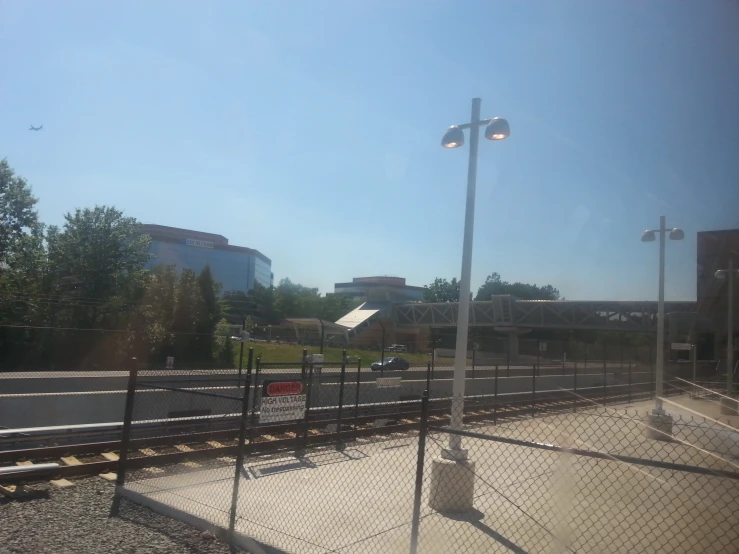 the fence has a street light by it