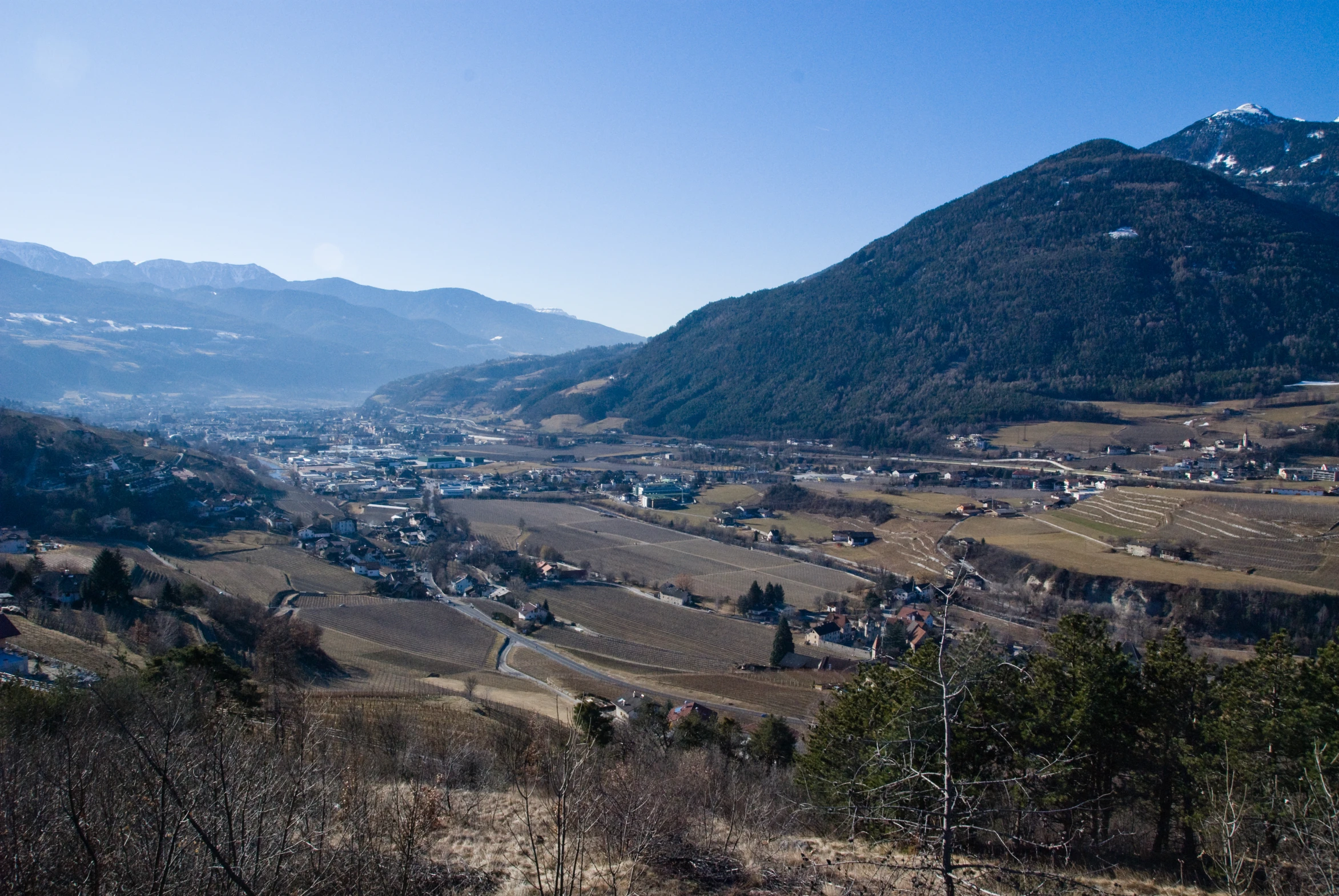 a landscape of a valley in the mountains