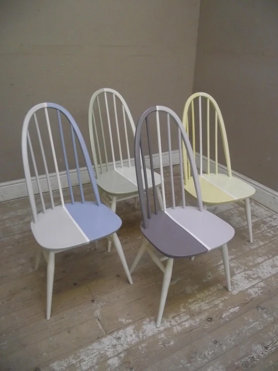 five different chairs in varying colors and shape