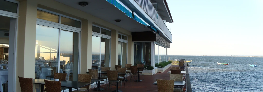 a large ocean filled with lots of tables and chairs