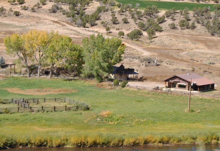 an image of a farm setting on the edge of the country