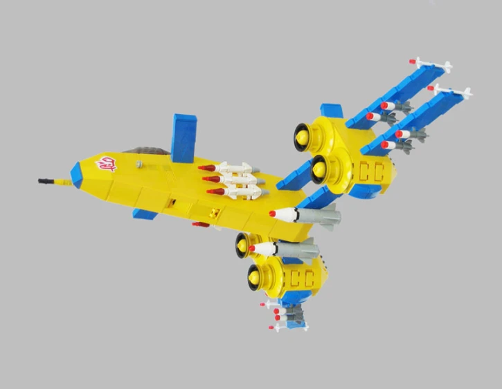 a lego yellow airplane flies through the air