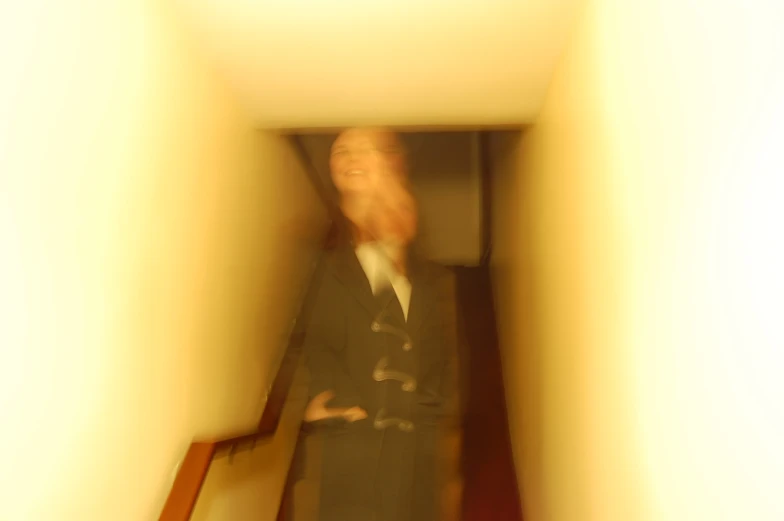 a blurry po of a woman in business attire
