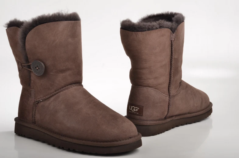 brown ugg boots on white surface