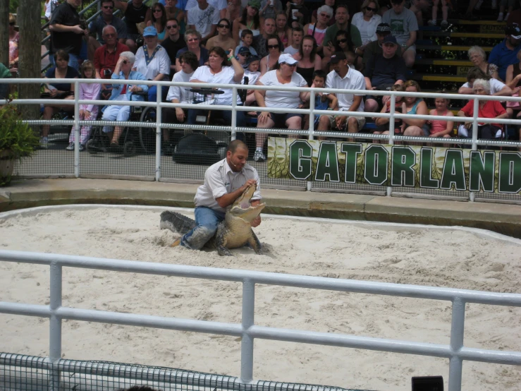 the man is doing soing in front of the crowd