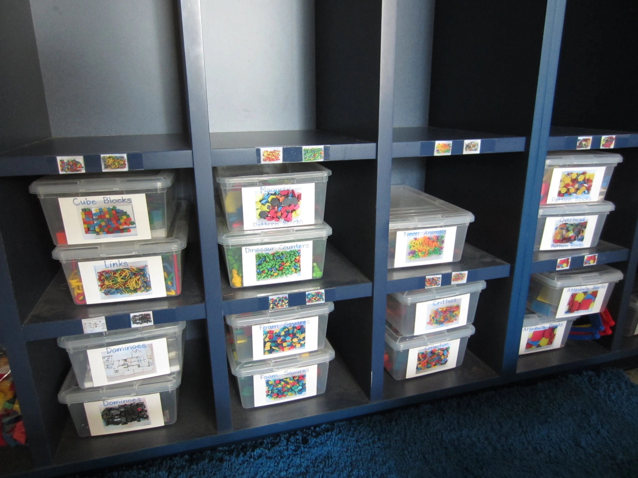 a room with several bins with different types of colored items